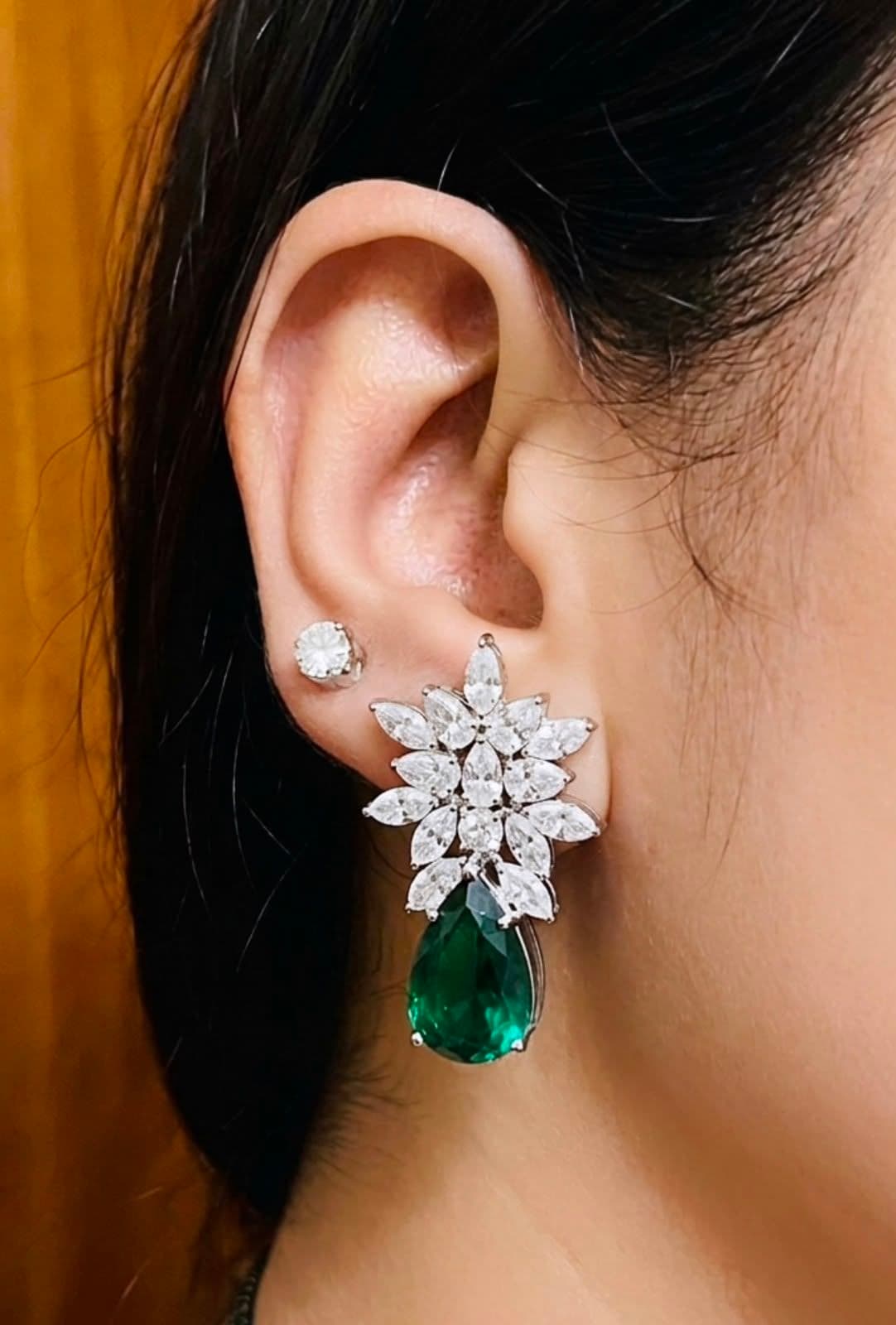 Divya wearing her emerald and diamond cocktail earrings